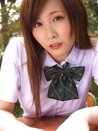 Schoolgirl Iyo Hanak poses at the open air in sexy skirt